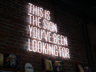 Neon sign that reads, "This is the sign you've been looking for."
